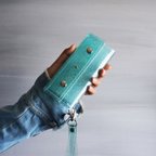 作品『ラメ入りスケルトン』ライトブルー　クリアiPhoneケース　透明手帳型スマートフォンケース 