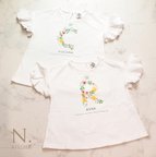 作品<枚数限定>お花のアルファベットと名前入り袖フリルTシャツ