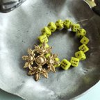 作品【1連15コセット】#czech beads#チェコビーズ　dice🎲7✖️7㍉ pistàcchio green/copper