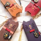 作品＊仕舞い忘れのベロ出しにゃんこ リボン付き＊leather sumyaho case＊猫の手帳型レザースマホケース