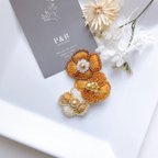作品【新作】オレンジ 花の連なり ビーズ刺繍ブローチ