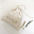 作品【SMILE巾着】愛された証を未来に紡ぐ「お守り刺繍」