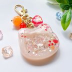 作品水晶入り♡花束柄がかわいいピーチカラーのシャカシャカ猫バッグチャーム/ミニミニハートもシャカシャカ！