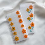 作品《iPhone全機種対応》レトロポップなお花のiPhoneケース(スマホケース)〈花柄〉レトロ クリアケース オレンジ