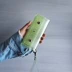 作品『ラメ入りスケルトン』メロングリーン　クリアiPhoneケース　PVC透明手帳型スマートフォンケース