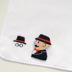 作品「紳士(黒)のバッジ」と「ワンポイント刺繍のハンドタオル」のセット 