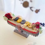 作品『おむつケーキ　フールセック🍪』　出産祝い　オシャレママ　大人ママ　お祝い　バースデー　ハーフ　ベビーシャワー　おむつケーキ　フラワー　　オムツケーキ　お菓子　クッキー　食べれません　アンティーク