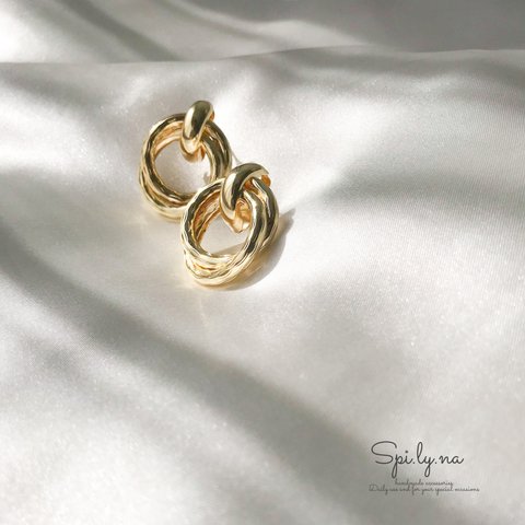 Gold ring pierces 