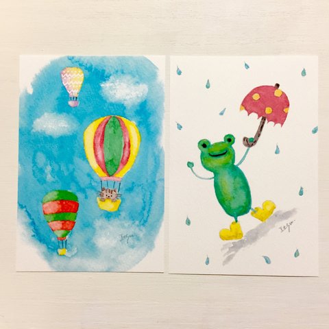 🐸透明水彩画「気球に乗った猫 雨大好きカエルくん」 イラストポストカード2枚セット ネコ　ねこ　かえる　父の日🐸