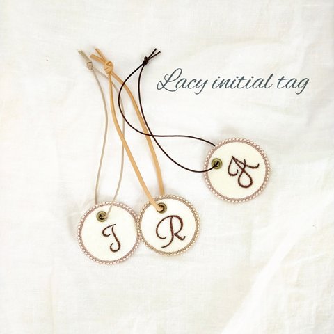Lacy initial tag