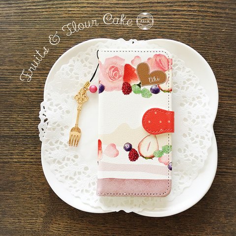 【ケースとお揃い☆壁紙に使えるデータ付き】名入れ　フルーツとお花のケーキ 手帳型スマホケース　ピンク系　ストラップ付き