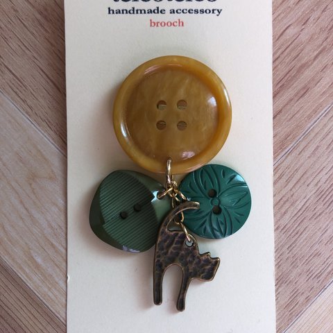 button brooch