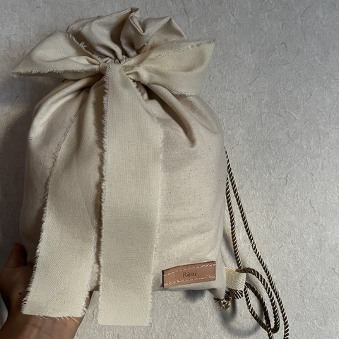 30-40日発送leather tag beigeナップサック