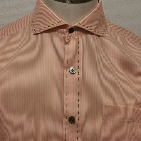 ハンドステッチ、オレンジピケのシャツ
