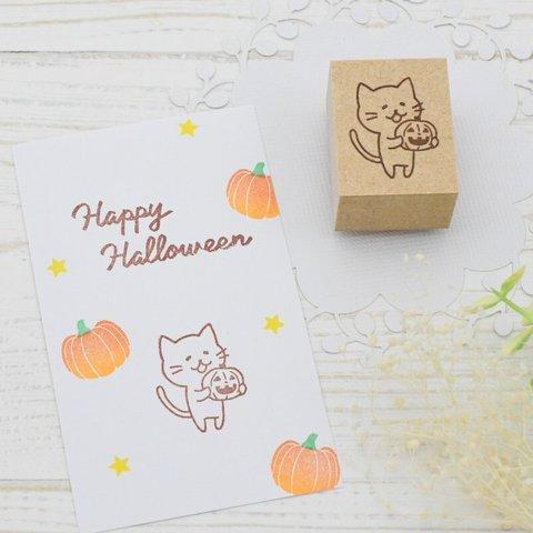 ハロウィンを楽しむ猫のはんこ かぼちゃを持った猫