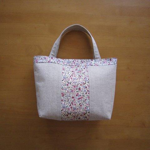 ピンク色の花柄・手持ちバッグ